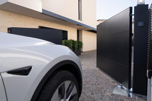 Automated driveway gate with motor and entrance controls